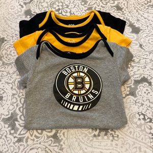 Set of 3 Bruins NHL onesies size 24m in great condition.